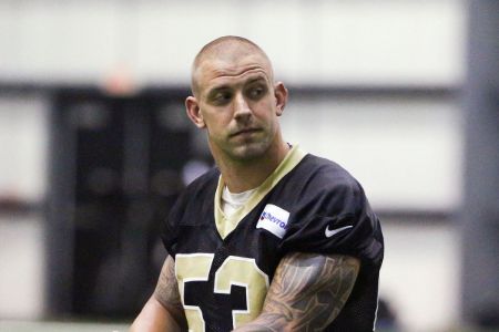 James Laurinaitis in a black kit poses for a picture.